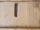 a picture of a wooden frame with a knife in it