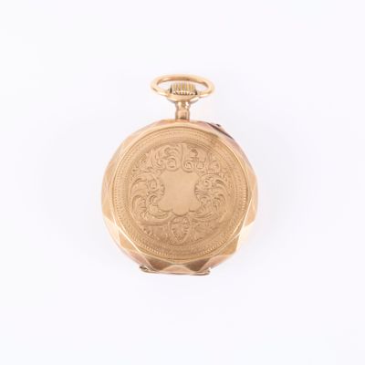 pocket watch on a white surface with a white background