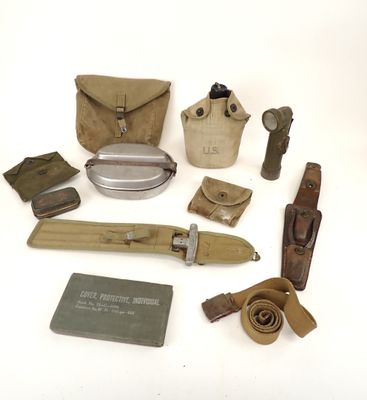 an assortment of military items including a knife, belt and other items