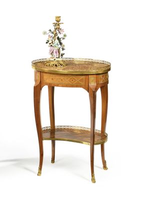 a small table with a vase on top of it