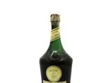 an image of a bottle of liquor sitting on top of a white surface