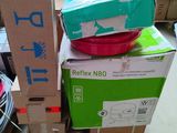 a pile of boxes and a bowl sitting on top of each other