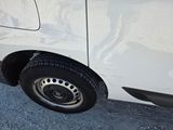 a white van parked on the side of the road