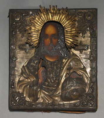 a picture of a metal plaque with a picture of jesus on it