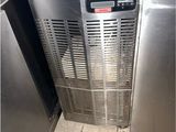 a stainless steel dishwasher that is in the corner of a kitchen