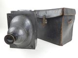 two metal boxes with a metal object inside of them