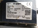 a label on the back of a machine that is sitting on a table
