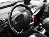 a steering wheel and dashboard of a car in a car showroom