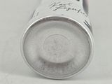 a can of soda sitting on a white surface