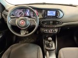 the interior of a car with a steering wheel and dashboard controls