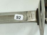 a close up of a knife with a number on it