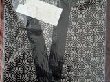 a black and white shirt and tie in a plastic bag
