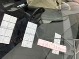 a picture of a car window with a sticker on it