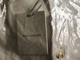 a tag on a jacket that says paul taylor