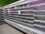 many empty shelves in the store for food to be bought