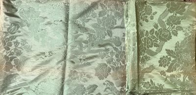 two pieces of fabric that are laying on the floor