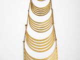 a gold plated necklace with a long chain hanging from it