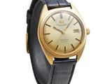 an image of a gold wrist watch with a black leather strap