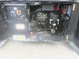 a machine that is sitting in the back of a truck