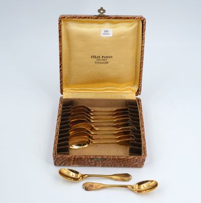 gold plated spoons and spoons in a case with a gold lining
