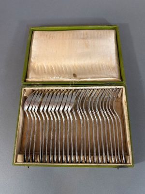 a box with a bunch of silverware inside of it
