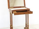 an image of a small wooden desk with a mirror on top of it