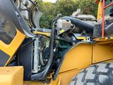 a picture of a construction vehicle with the door open