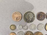 a lot of coins that are on the table