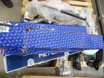 a blue suitcase sitting on top of a pile of boxes