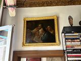 a picture of a living room with a bird hanging from the ceiling