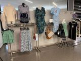 a lot of clothes on a rack in a store