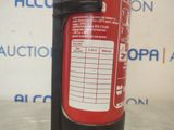 a red fire extinguisor sitting on a table