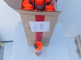 a cardboard box filled with oranges on a white table