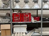 many shelves with various items on them in a warehouse
