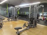 a gym with a lot of equipment in the room