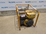 an image of a small pump sitting on top of a cement floor