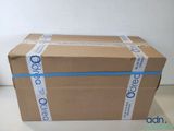 a box that is sitting on a table with a blue ribbon around it