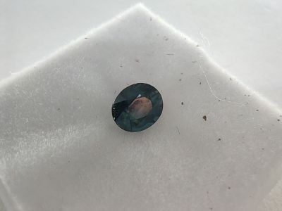 a picture of a piece of glass on a white cloth