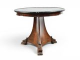 une table ronde avec un plateau en verre et des pieds en bois
