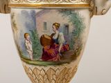 a vase with a picture of a woman and a child on it