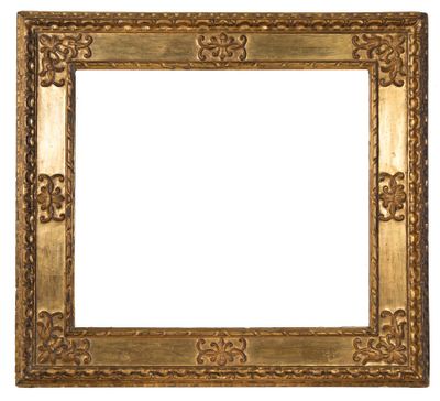 an old gold frame with a decorative pattern on a white background