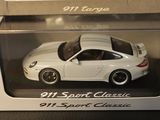 a white toy car in a box on a table