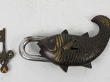 a fish shaped lock with a key in it