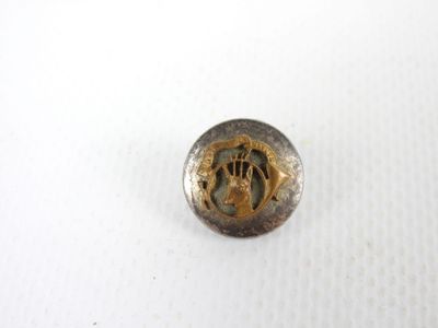 une image représentant un bouton orné d'une effigie de Jésus