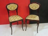 pair of antique chairs with upholstered upholstered backs