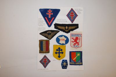 a picture of a wall with a bunch of patches on it