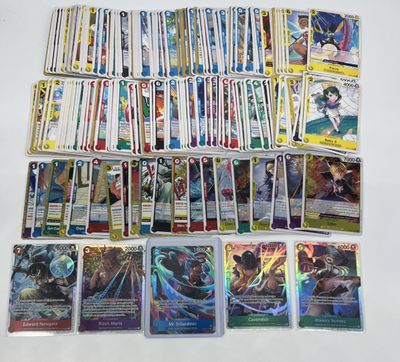 a lot of different pokemon cards on the table
