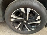 the tire of a car is shown with the rim on it
