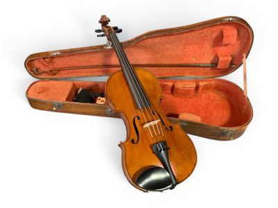 a violin that is sitting in a case on the floor