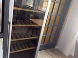 a wine cooler in the corner of a room